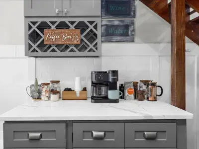 Fully stocked coffee bar equipped with a Keurig Duo, K cups, creamer, sugar, tea bags, ground coffee, coffee beans, a French press, etc.... a coffee drinkers dream!