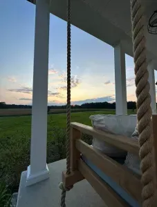 Shared front porch. (We use the front entrance since the rental entrance is on the side but are not usually on the porch unless entering or exiting the home).