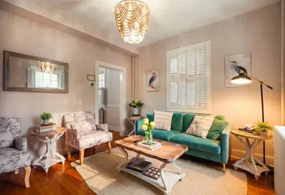 Newly renovated living room with ample seating, 55” smart TV for streaming, and a cozy Historic charm with a professional design touch!
