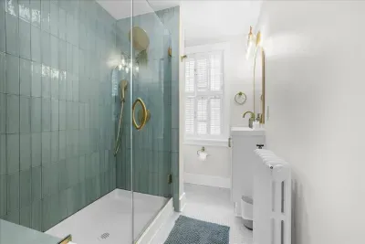 Bathroom #2 located at the top of the stairs on the 2nd level.  A full shower equipped with shampoo, conditioner, bodywash, poo pourri, makeup towels, etc.