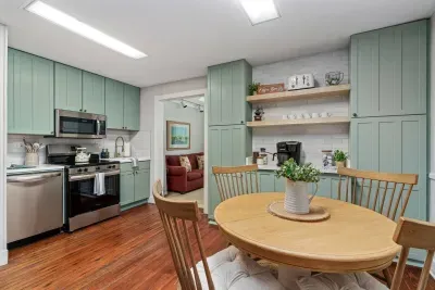 Spacious kitchen with 4 burner electric stove/oven, microwave, refrigerator with water dispenser and ice maker, dishwasher, and full coffee bar!