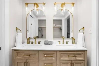 Ensuite bathroom with stunning custom double vanity and beautiful gold accents to ensure a relaxing stay and comfortable start to your day!