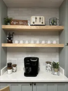 Coffee bar fully stocked with k cups, coffee beans, ground coffee, a Keurig with coffee pot, and cream and sugar to enjoy your mornings!
