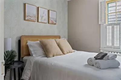 Second upstairs bedroom (full size bed) with a luxurious southern vibe and professional design touches!