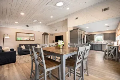 Enjoy a home cooked meal in the well-lit dining room with seating for 8 at the dining room table.
