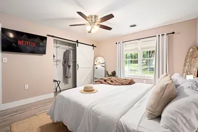 King suite elegantly designed to ensure maximum comfort with your own private robes, 43" smart TV, closet space, full length mirror, and private full bathroom.