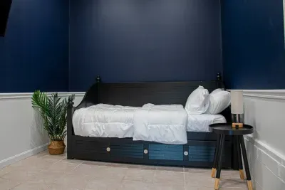 Bedroom #4 with a single bed located in the detached Gameroom for parties of 9.