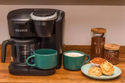 Brew a delicious coffee from your very own coffee bar!  Fully stocked with K cups, fresh ground coffee, coffee beans, etc.