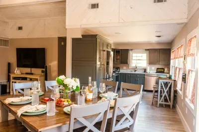 Enjoy a home cooked meal in the well-lit dining room with seating for 8 at the dining room table.