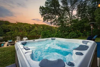 Additional photo of the fire pit area and 8 person Bull Frog hot tub.