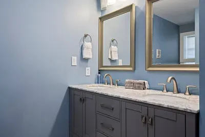 Private double vanity and full bathroom in the king suite for convenience.