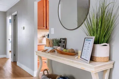 Our welcome sign with WIFI information, host information, etc. located conveniently at the top of the entry stairs.