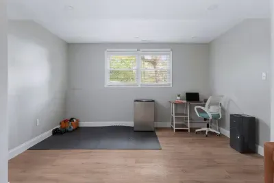 Downstairs yoga, exercise area, and workstation for the remote work travelers visiting.  