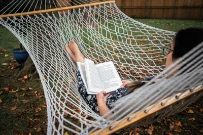 Relax in our private 2 person hammock conveniently nestled between three trees wrapped with twinkling string lights that light up the night when the sun goes down.