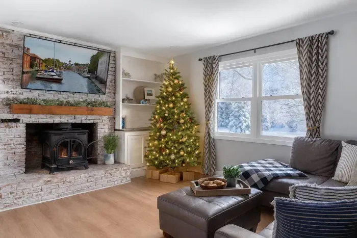 Enjoy making memories with family and friends around the living room decorated for the Holidays while warming up next to the wood burning fireplace!