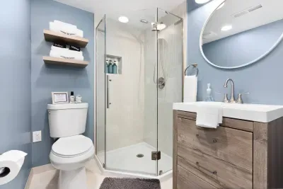 Full bathroom downstairs with walk in glass shower and fully stocked with shampoo, conditioner, body soap, hand soap, and Poo-Pourri, Makeup towels, and Q-tips.
