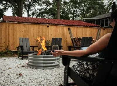 Relax with a book at our luxurious, custom fire pit with 2 hanging egg chairs.