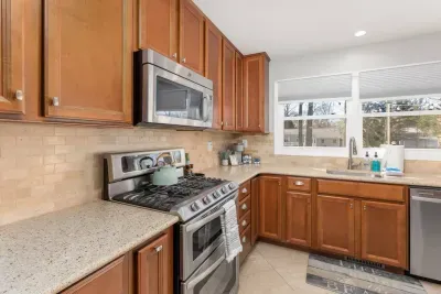 Fully stocked kitchen with coffee/tea station.