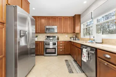 Our fully stocked kitchen includes a gas oven and 5 burner stove top, fridge and freezer combo with water and ice dispenser, microwave, dishwasher, silverware, plates, etc.