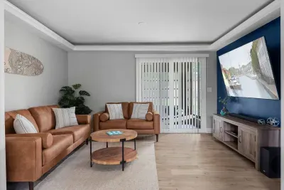 Downstairs living room with a 65" big screen TV and soundbar to watch your favorite sporting events or stream your favorite shows!