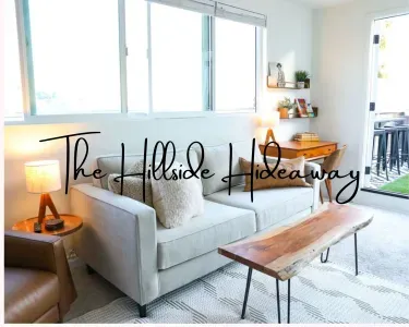 Welcome to The Hillside Hideaway! This unique rental offers two separate units, perfect for two families or couples vacationing together who want their own private space.Step inside  to discover a one-of-a-kind blend of mid-century retro-chic.