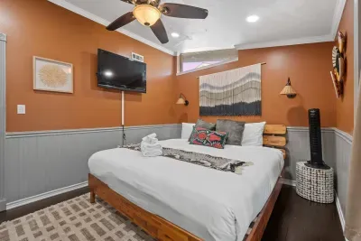 Bedroom 2 features a plush King sized bed and smart TV