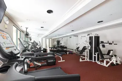 Gym with TV's, overlooks the pool