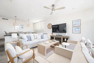 Sunken living room with 65" TV, Amazon Echo, Sony Sound Bar