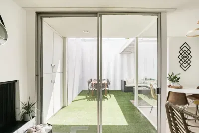 Unique floor-to-ceiling sliding doors lead you to your soon-to-be favorite space to work, relax, or dine - the 200 square foot private patio.