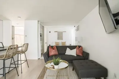 Sleep cozy in this open-concept room with linen divider to the second sleeping / den space.  Leave the divider open for a Studio apartment vibe, or close off for full privacy.