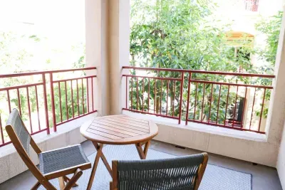 Peaceful balcony overlooks fountain