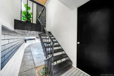 Entrance with stairway leading to front door