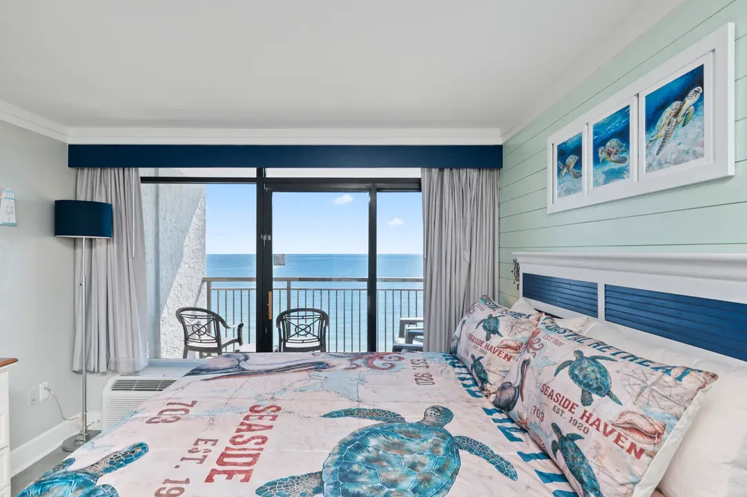 Coastal king bedroom with private balcony and stunning ocean views
