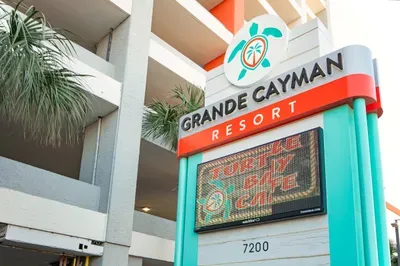 Grande Cayman Resort entrance with tropical style and on-site dining