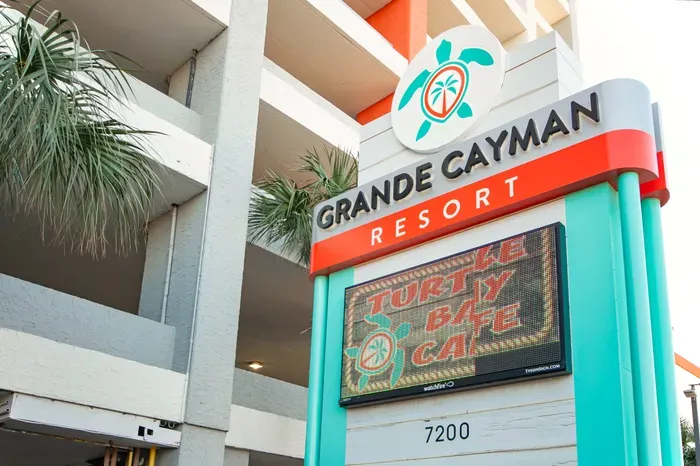 Grande Cayman Resort entrance with tropical style and on-site dining