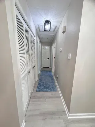 Bright, stylish hallway with ample storage and modern coastal touches