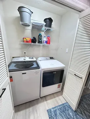 Convenient in-unit washer/dryer with organized storage shelves