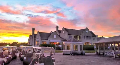 Elegant golf club retreat with sunset views and carts ready to roll