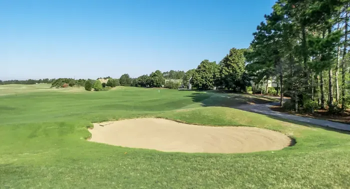 Fairway-front retreat with sweeping golf course views and blue skies