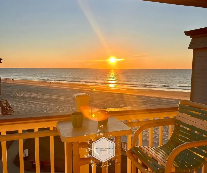 Private beachfront balcony with stunning sunset and ocean views