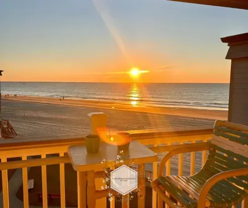 Private beachfront balcony with stunning sunset and ocean views