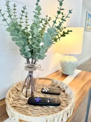 Warm, stylish console table with soft lighting and natural décor