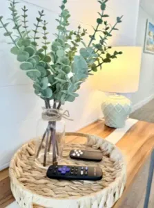 Warm, stylish console table with soft lighting and natural décor