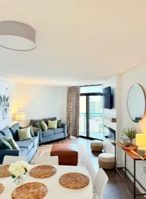 Bright modern lounge with balcony access and stylish open-plan dining