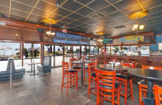 Spacious beachfront bar with water views and casual dining atmosphere
