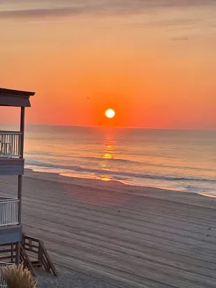 Oceanfront balcony sunrise views + private steps to wide sandy beach