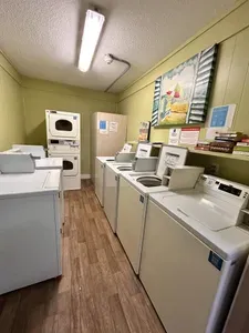 The first two washers accept the Shinepay app & the stacked dryers accept the Shinepay app. The other w/d are coin operated. $2