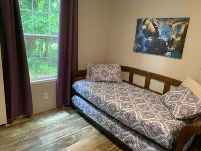 Trundle bed, the bottom bed rolls out and makes two twin beds side-by-side