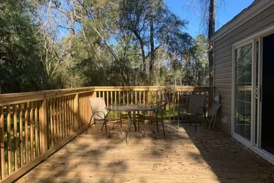 The deck remains shady for most of the day
We recently installed a large sun umbrella to keep things cool