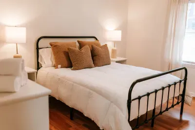 Simple, inviting bedroom blending classic style with cozy, restful design.